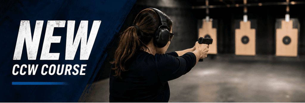 Woman aiming handgun at indoor shooting range.