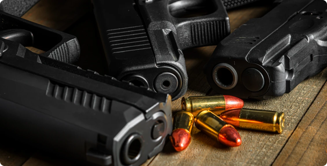 Pistols and cartridges displayed together
